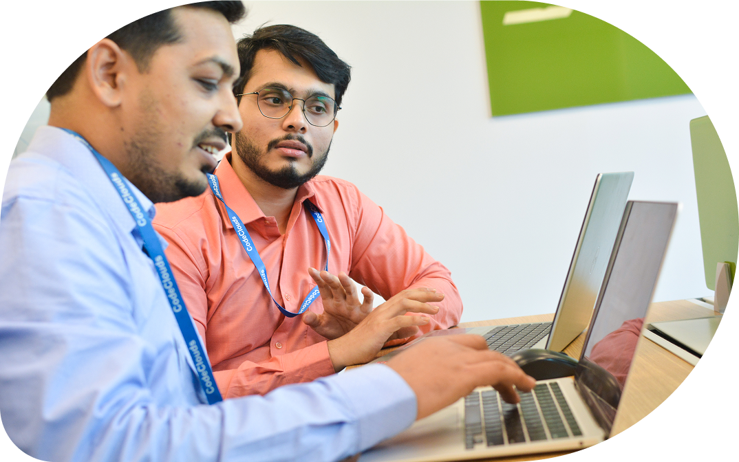 AsterMD developers working together at a laptop